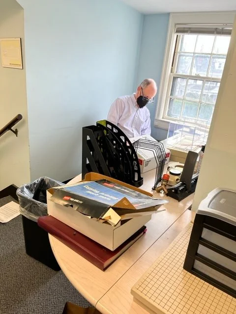 Ken Baily reviewing items for possible disposal