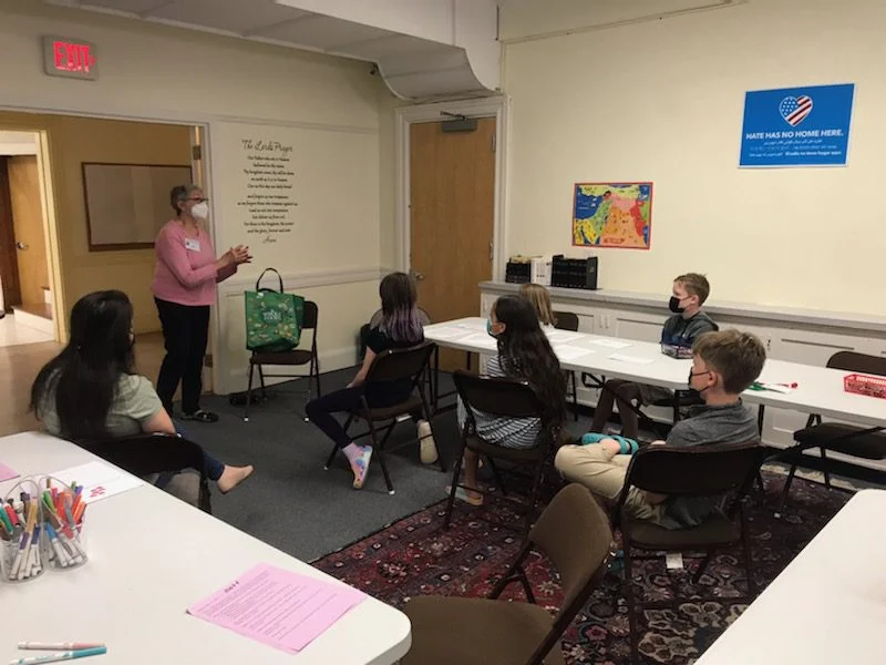 Adult speaking to church schoolers