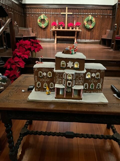 gingerbread house in front of church sanctuary