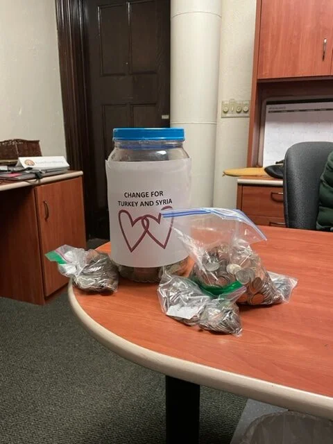 jar for collecting coins, plus bags of coins