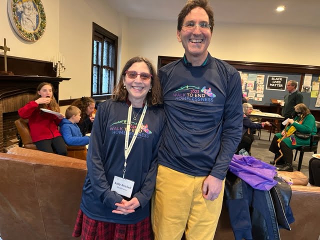 Sally Brickell and Jeff Kaplan in shirts from Family Promise Metrowest Walk to End Homelessness