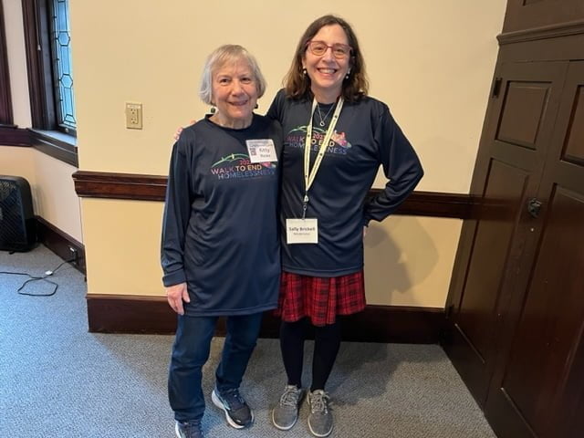 Kitty Rieske and Sally Brickell in Family Promise Metrowest Walk to End Homelessness shirts, in church parlor