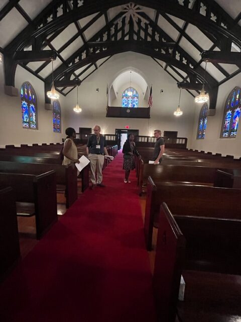 Visiting in pews after worship service