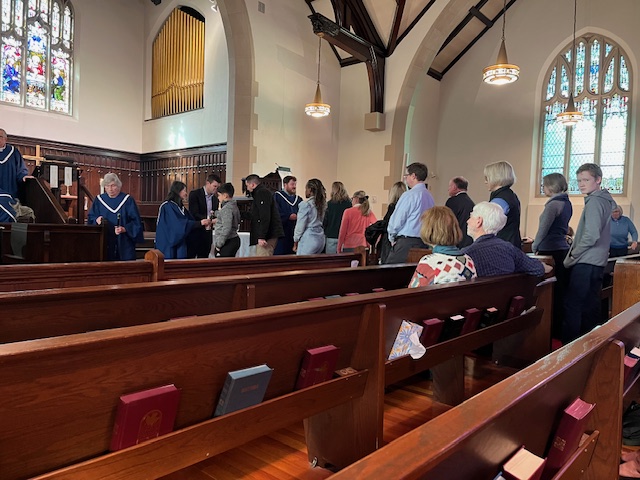 congregation celebrating communion in sanctuary