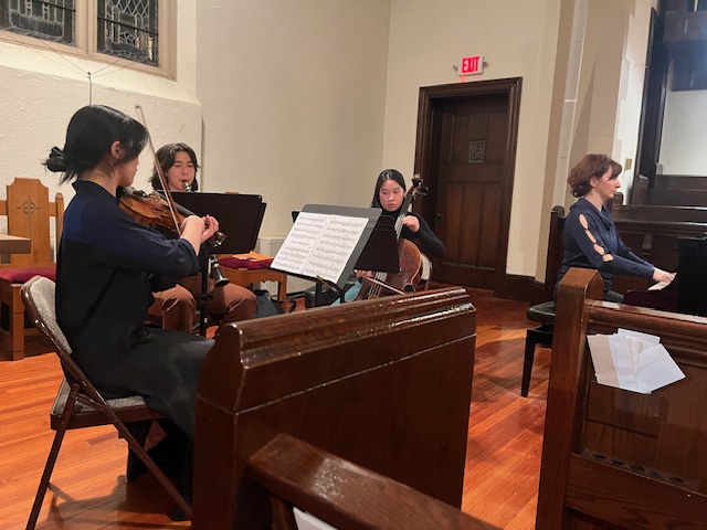 musicians playing violin, cello, viola, and piano