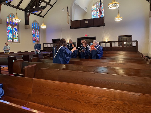 Choir singing in pews