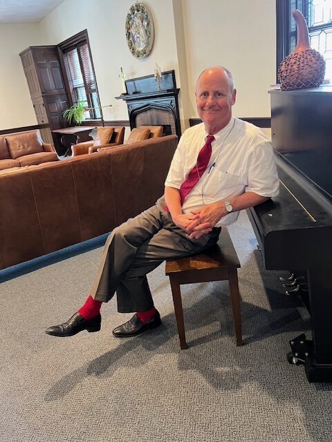 Ken Baily wearing red socks for Pentecost
