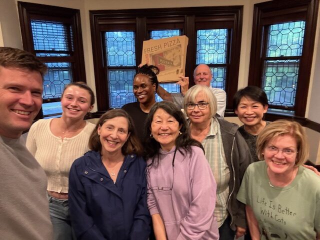 Selfie from Wednesday Worship group gathered in parlor smiling faces