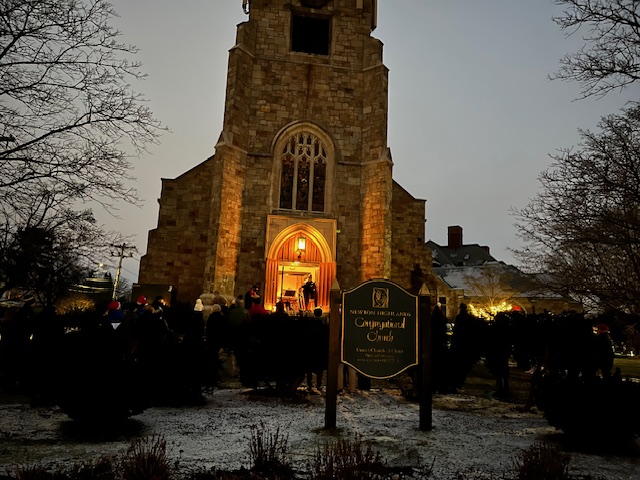 church entrance at night with glowing interior light
