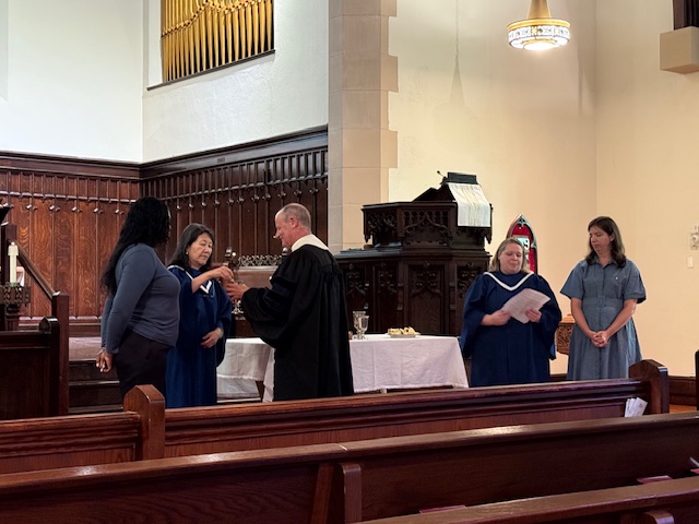 Communion September 7, 2025 Deacons and pastor at communion table in front of sanctuary