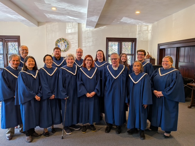 Group of robed singers in church parlor