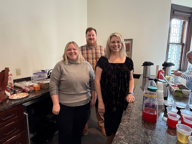 three choir members serving coffee after church