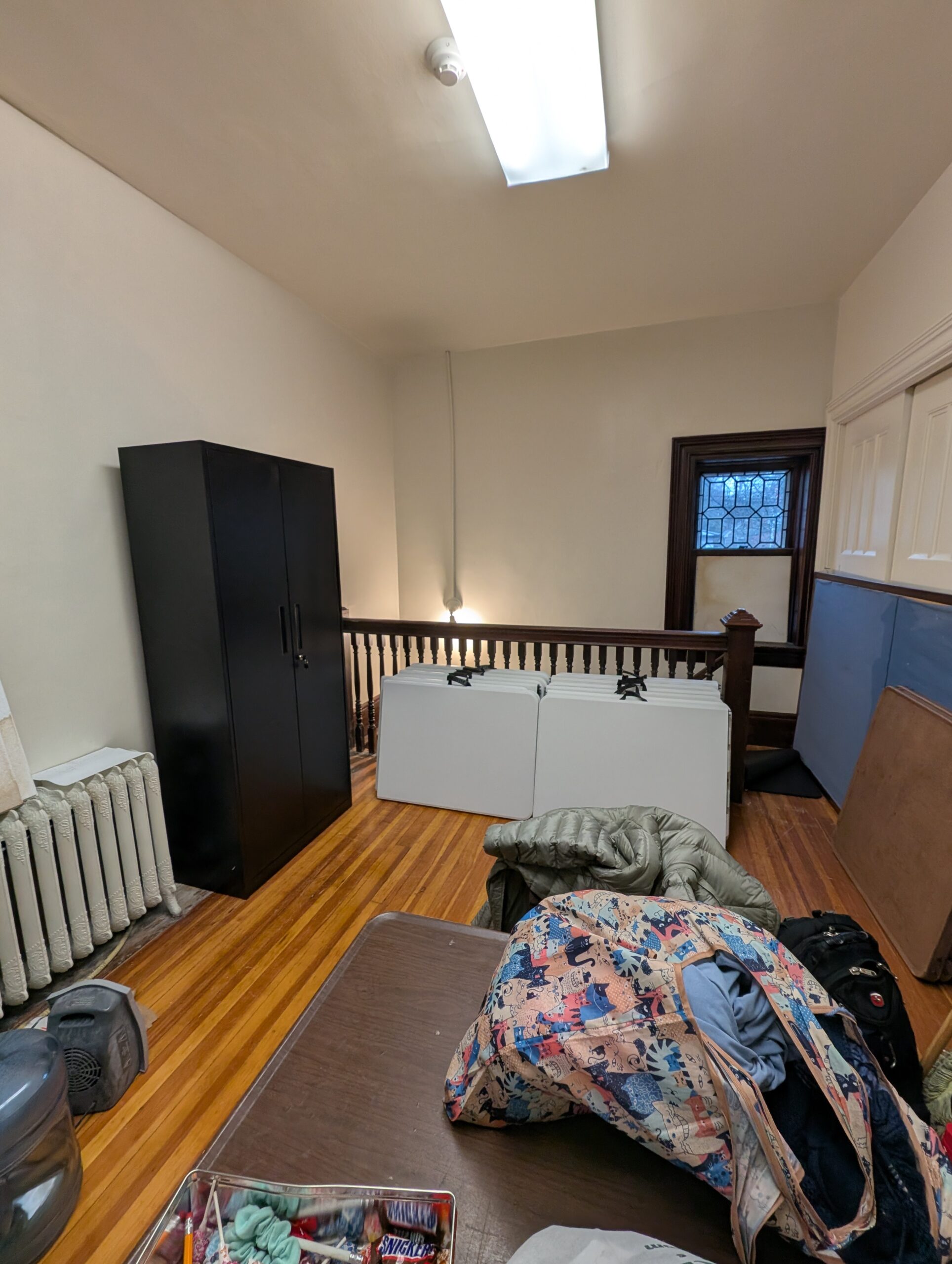 Black metal cabinet in closet