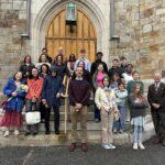 Walkers gathered on church steps